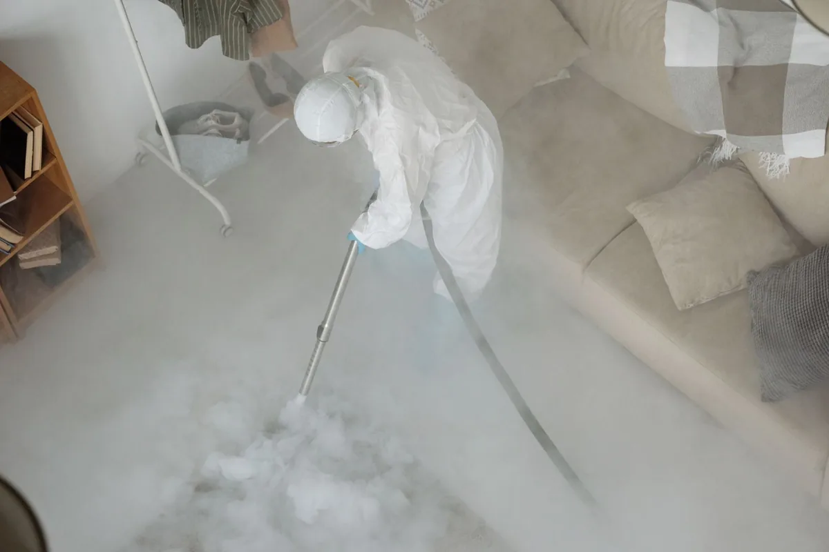 Biohazard cleanup technician in protective equipment, Red Hook, NY